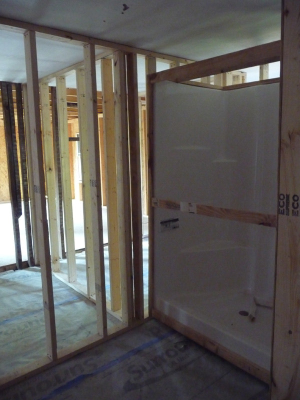Shower stall in place in bathroom