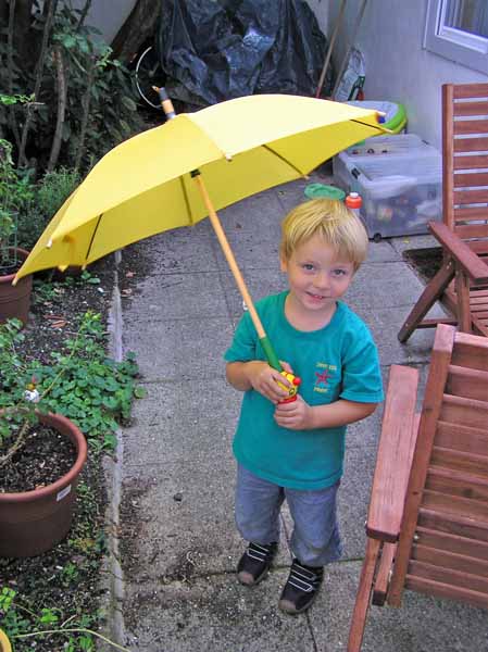 Isaac with umbrella